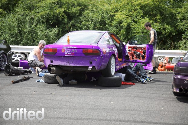 Ashley's car being fixed in the heat