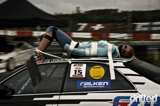 A danish tradition: Carrying bondaged woman on the roof of a car ;)