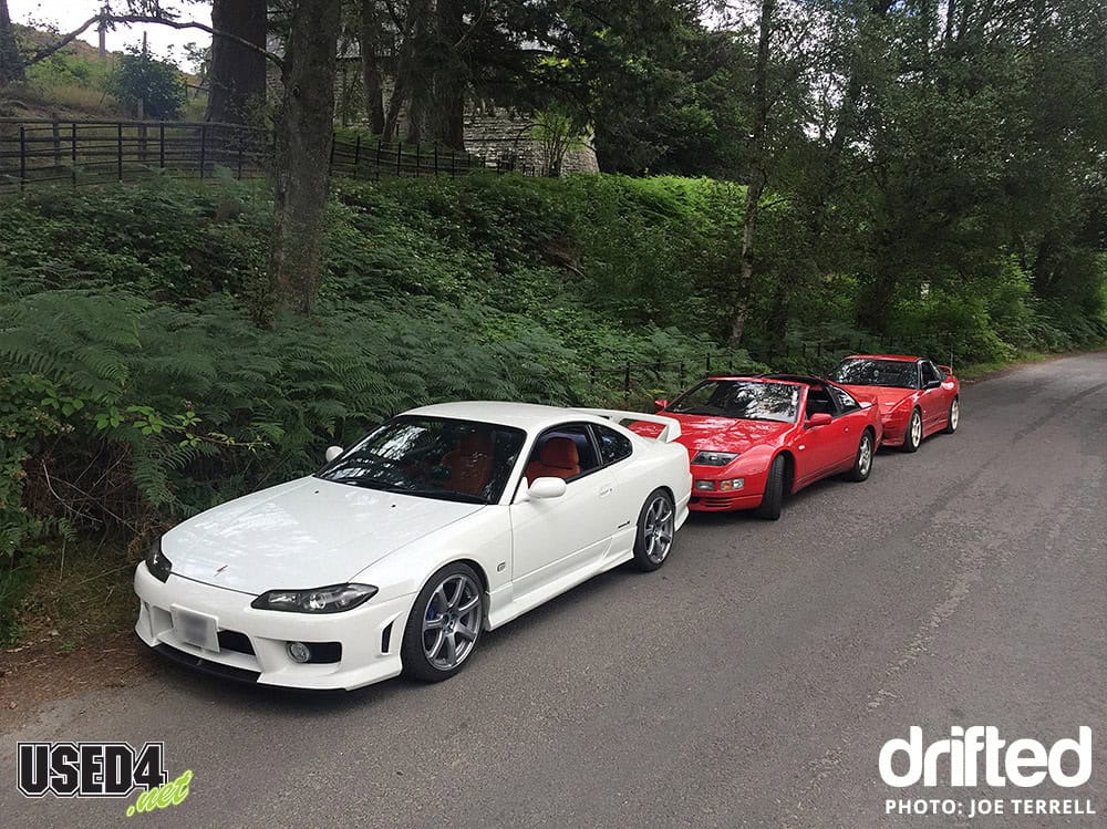 cars lined up in woods