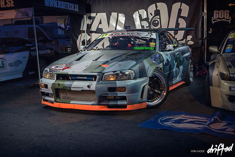 A nissan skyline gtr r34 drifting in togue on Craiyon