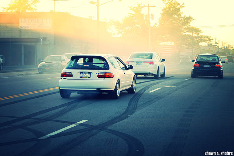 white civic street race bmw m5