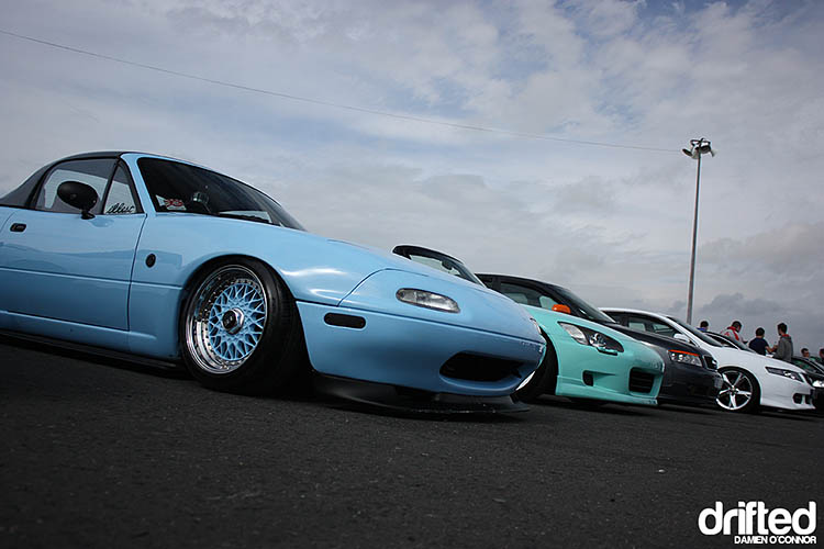 blue miata parked