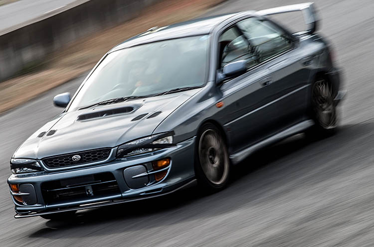 grey race car pan speed impreza