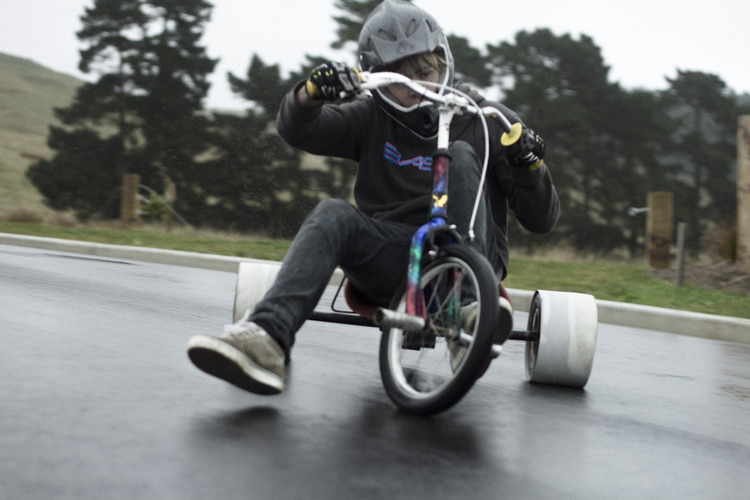 kid on a electric drift trike